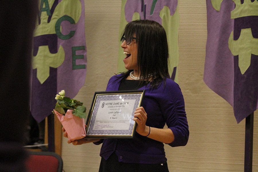 Spanish teacher Leah LaFaver receives an award for 5 years of teaching at the high school.