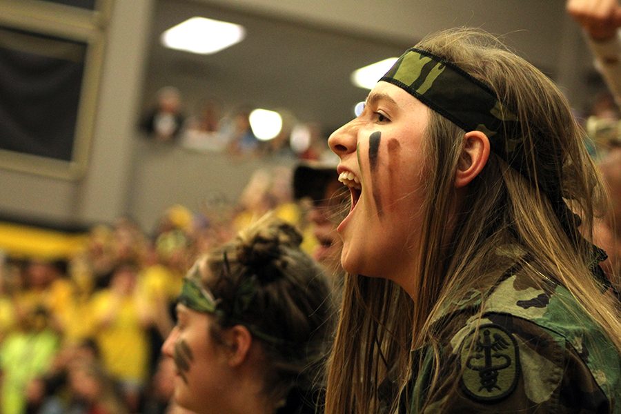 Scream Team leader senior Maddie Marquardt keeps spirits high and leads the crowd in a chant. 