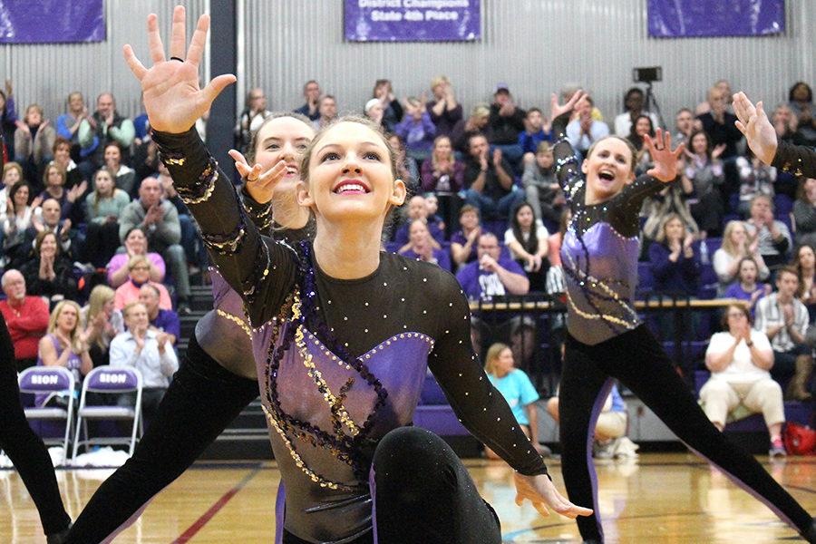 Junior Livvy Wood looks to the student section during dance team’s halftime performance.
