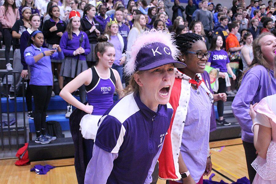 Athletic Director Kate Pilgreen, who acted as the team coach, cheers on the team while playing St. Teresa's Academy.