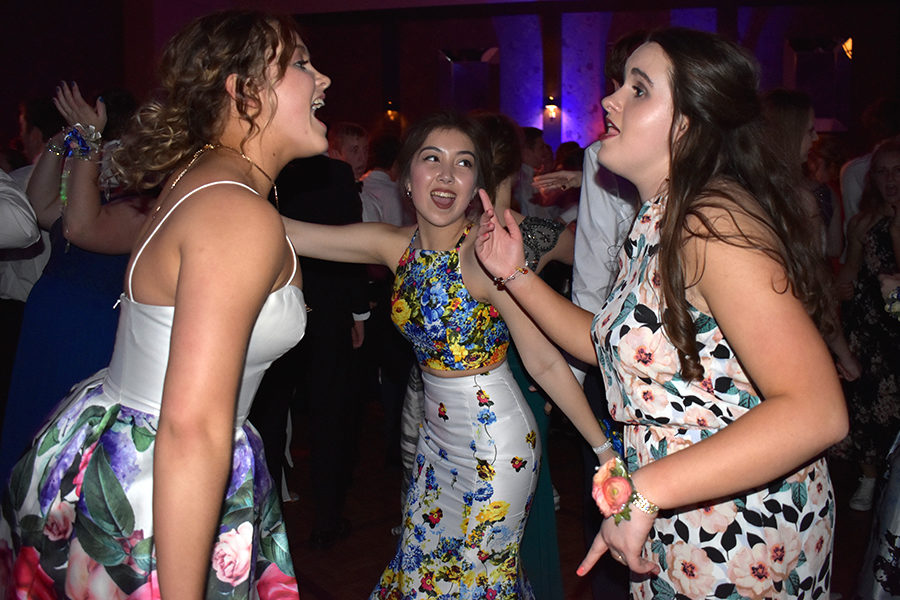 Seniors Ali Odermann and Maria Arroyo sing with junior Paige Shankland to “Party in the USA.”