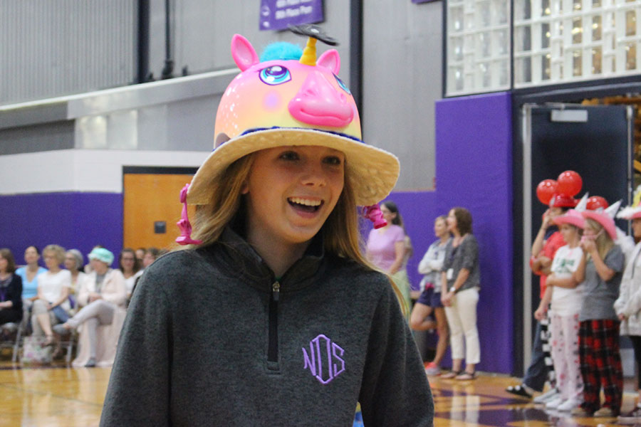 Freshman Katelyn Brinkman smiles after receiving her beanie.