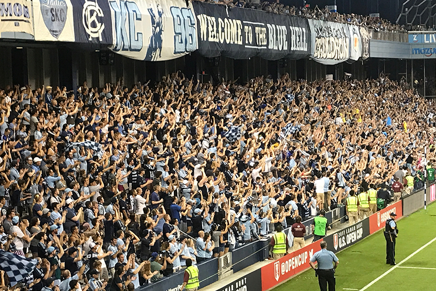 The Sporting Kansas City section known as "The Blue Hell" Cheers as a goal is scored. 