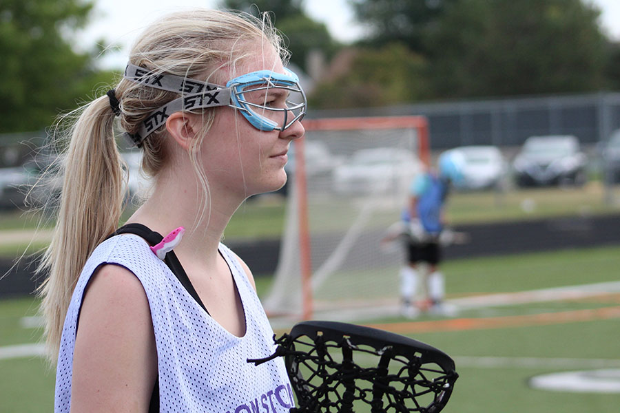 In a 7v7 game against Blue Valley North, senior Anna Tomka stands ready to defend the goal.