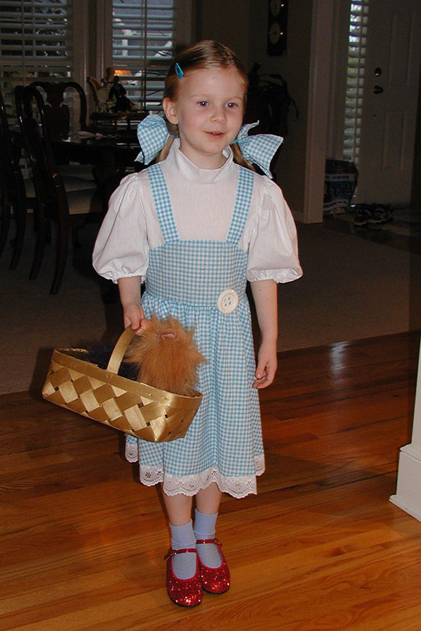 At 3 years old, senior Anna Tomka poses for a picture dressed as Dorothy Gale from “Wizards of Oz.”