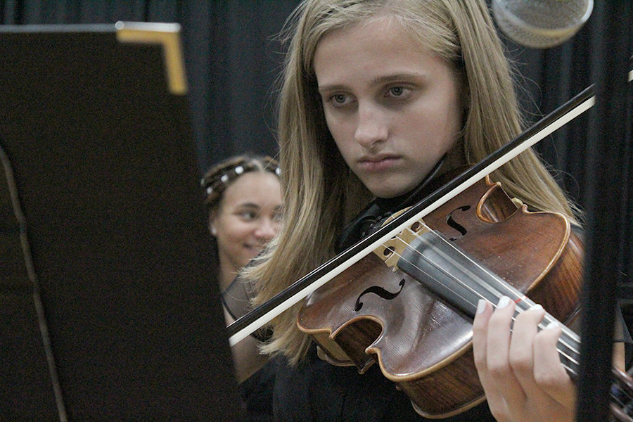 Junior Emma Hutchin concentrates on her violin performance during Her Majesty's Theatre on Oct. 18. 