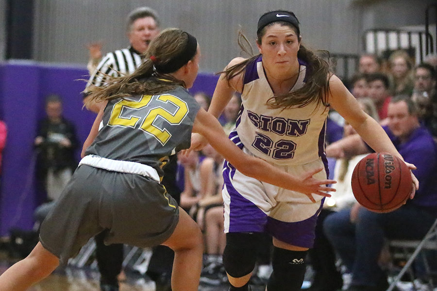 Senior co-captain Sarah Totta dribbles past STA defender.