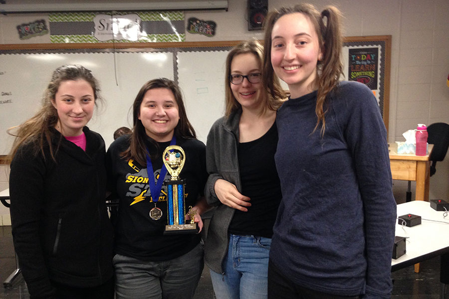 Seniors Karolina Rooney, Gillian Cruz, Julianna Alaman and Emily Bello pose for a picture after winning third overall in their tournament.