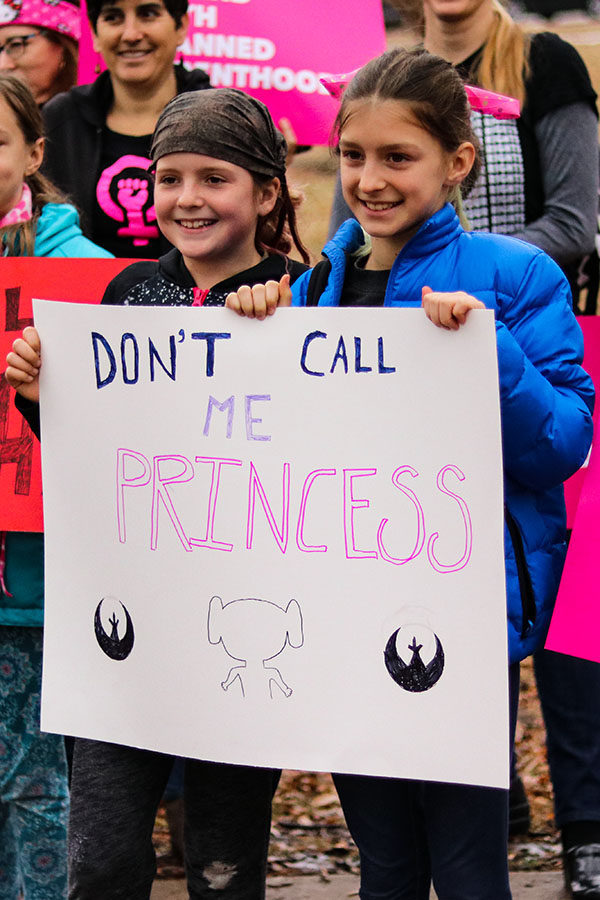 Young participants in the Women’s March in Lawrence, Kansas pose for a picture with their sign Jan. 20.