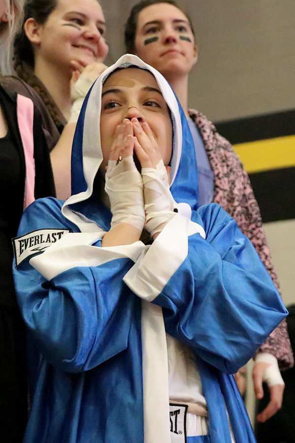 Senior Scream Team Leader Mandy Mayer watches from the sidelines, shocked, as the ref makes questionable call in the St. Teresa's Academy basketball game Saturday, Feb. 24 that ended in a 50-42 victory. 