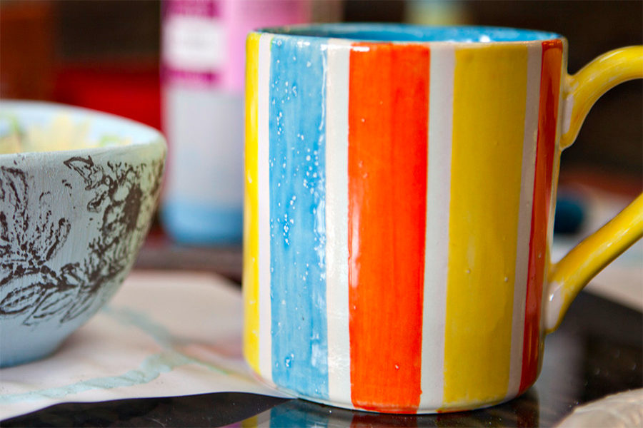 A ceramic mug that was painted by a customer and then glazed.