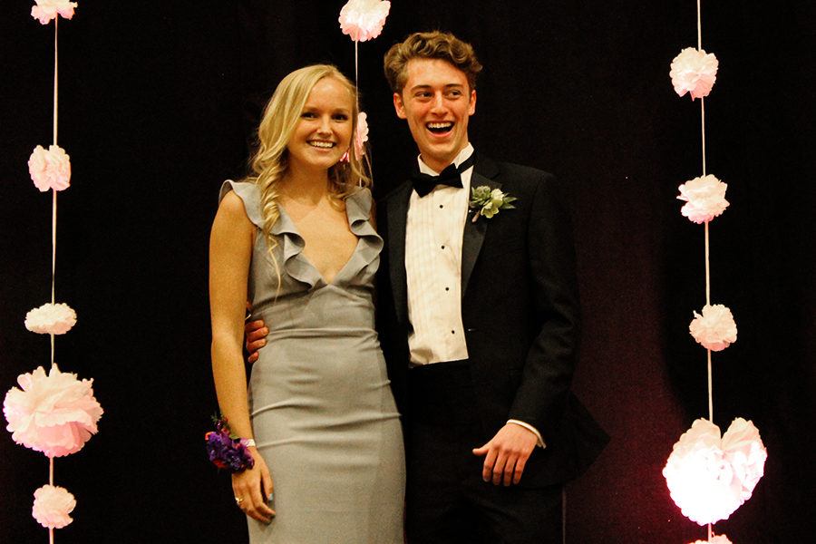 Senior Catherine Dehaemers and Rockhurst High School Senior Joe Hathaway stop in the middle of the stage during introductions, which took place before the Prom queen and attendees were announced.