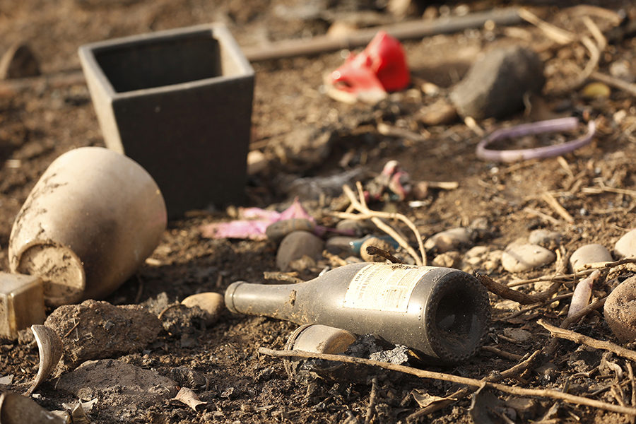 Charred debris litters the base of the Malibu hillside.