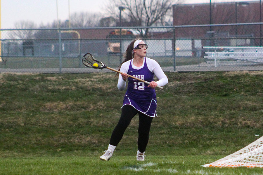 Senior Mariah Lynn throws the ball inbounds in a game vs. Lee’s Summit North April 19.