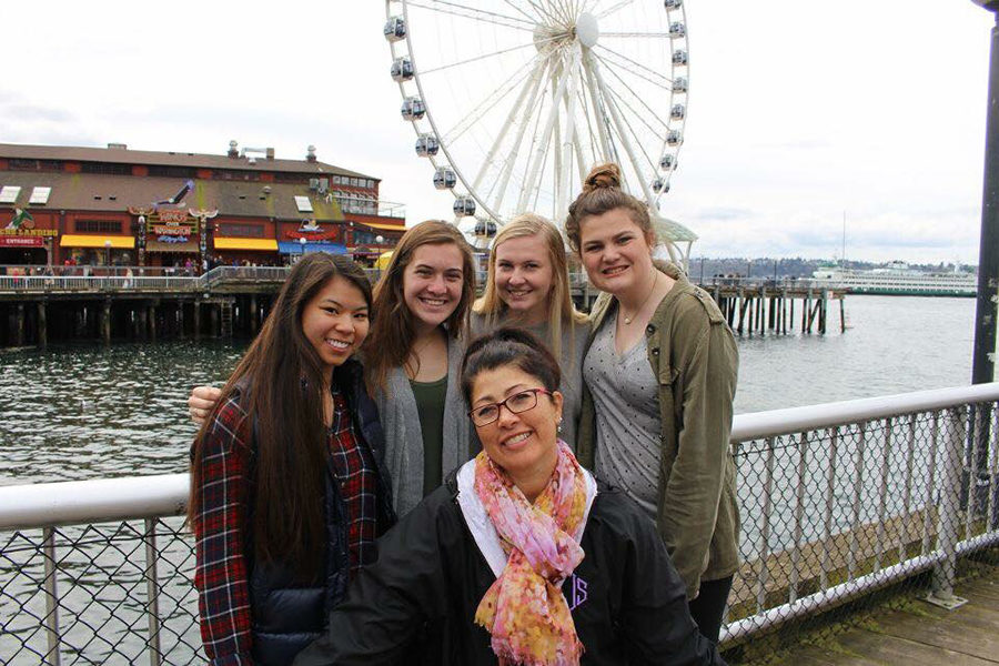 Seniors Courtney Hiatt, Lanie Jones, Anna Tomka, Kelly Nugent and journalism teacher Alison Long explore the pier in Seattle for the 2017 National High School Journalism Convention, the same weekend as Prom.