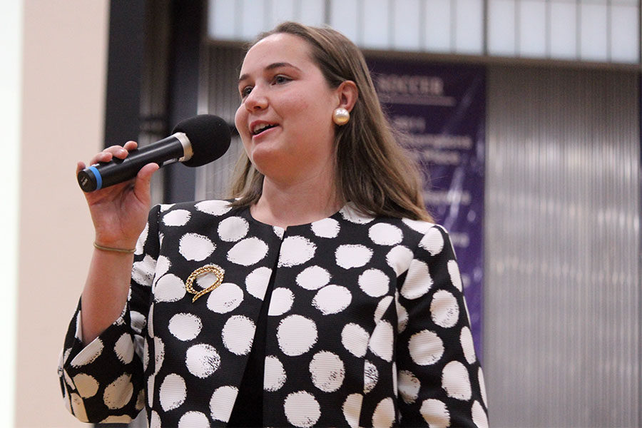 Playing former Head of School Christina Broderick, senior student body president Carolyn Dickey gives a thank you to students for their anticipated contributions to the canned food drive. As a school, the goal of 10 tons was exceeded with a total of 12.3 tons collected.