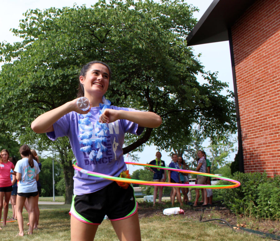 Senior Caroline Hunter hula hoops at Summer Splash.