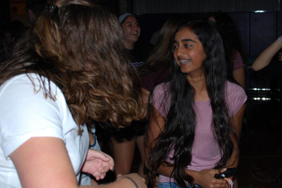 Sophomore Rajitha Velakaturi talks with friends at last years freshman mixer, Aug. 26, 2017. Freshman from Rockhurst and St. Teresa’s are also invited to come.