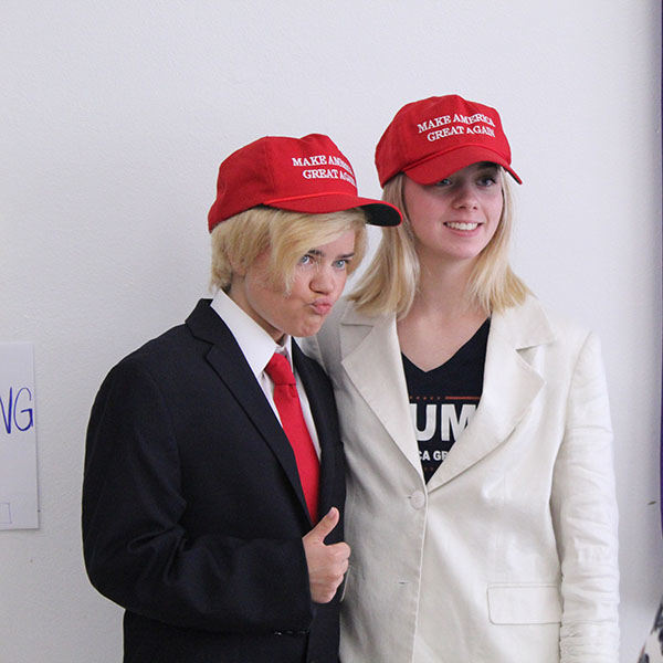 Dressed up as President Donald Trump and First Lady Melania Trump, seniors Liz Oltjen and Tori Beaver pose for picture during celebrity couples day Sept. 20.