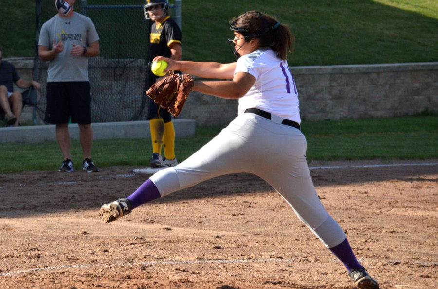 Junior Maya Bair pitches the softball during the game against St. Teresa’s Academy Sept. 12. Varsity lost in five innings 18-1.