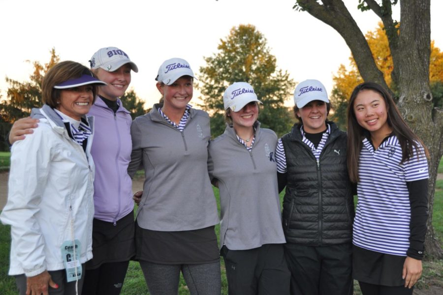 Golf coach Dana Hoeper, Junior Barbara King, Sophomores Megan Propeck, Lia Johnson, Caroline Giocondo and Junior Helen Willis get their picture taken after winning second place for the second year in a row at the Class 2 State championships at Swope Memorial Golf Course Oct. 16.