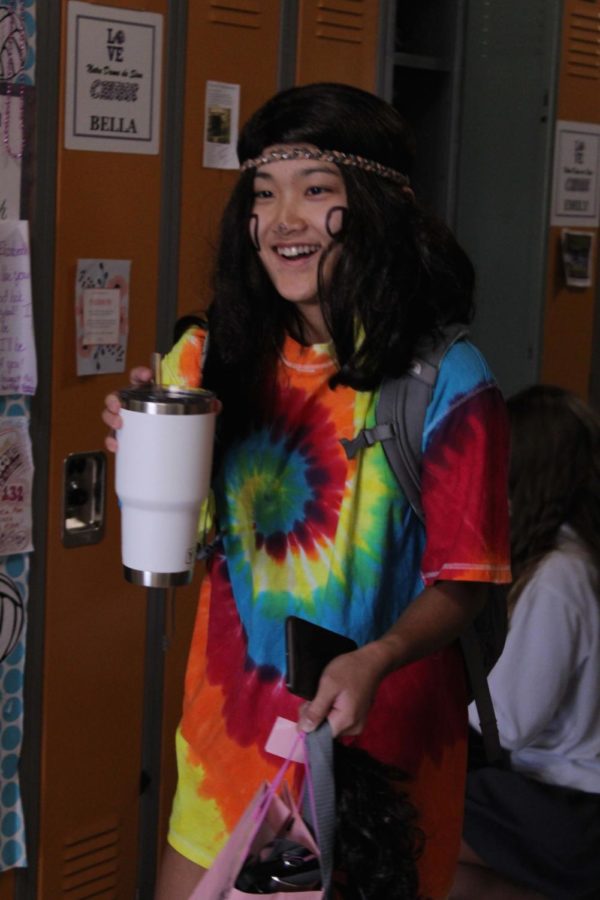 Junior Caroline Ehren walks to class dressed up as a hippie for Halloween, Oct. 31. 