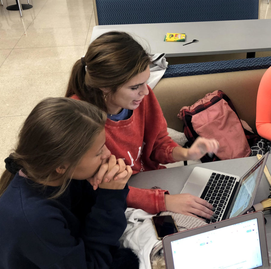 Juniors Emily Rine and Reilly Jackoboice made adjustments to their skit during the STUCO sleepover Oct. 24. The junior skit was set at a family Thanksgiving dinner. 