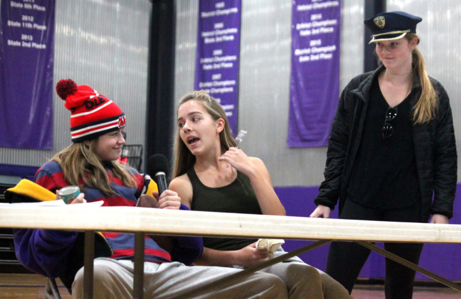 Sophomore Audrey O’Brien questions sophomores Brynna Dow and Avery Brundige during their skit about stolen cans in the gym Oct. 25.