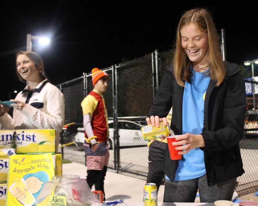 Sophomore Kate Vankeirsbilck sells lemonade at the Rockhurst football game for her club. 