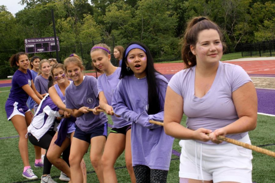 Purple team members line up to face the white team in Tug-o-War Sept. 21 at the Purple White Field Day.