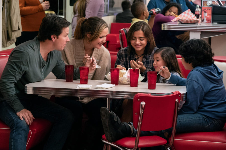 Parents Pete and Ellie enjoy an ice cream sundae with their foster kids Lizzy, Juan and Lita. 