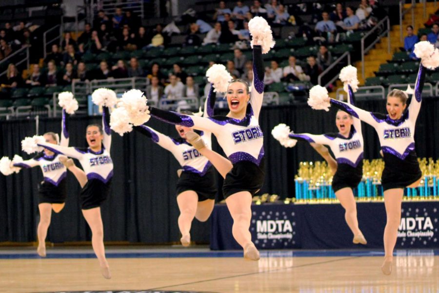 Co-captain senior Megan Broomfield leaps during Dance Team’s pom performance at State Feb. 23. The team won first for their pom performance and first overall for the tenth consecutive year.