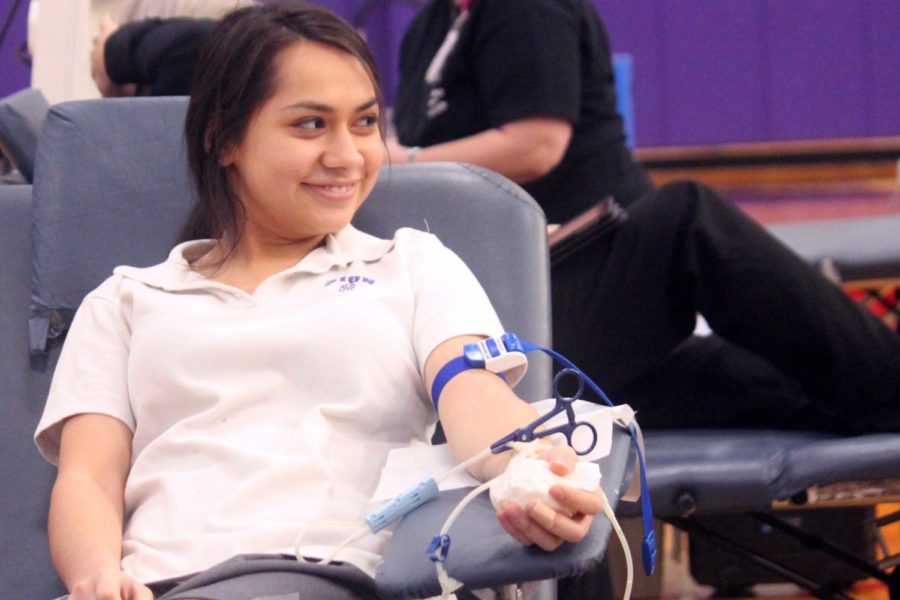 Junior Denise Carmona donates blood at the annual blood drive organized by the National Honors Society, Feb. 2, 2018.