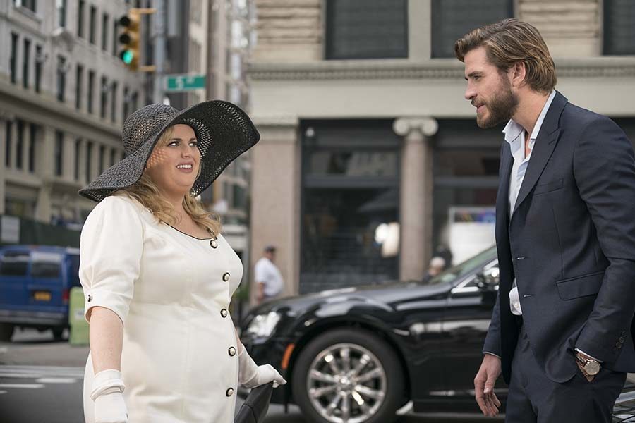 Natalie played by Rebel Wilson and Blake played by Liam Hemsworth, have an awkward conversation while standing in the middle of the street in New York city. 