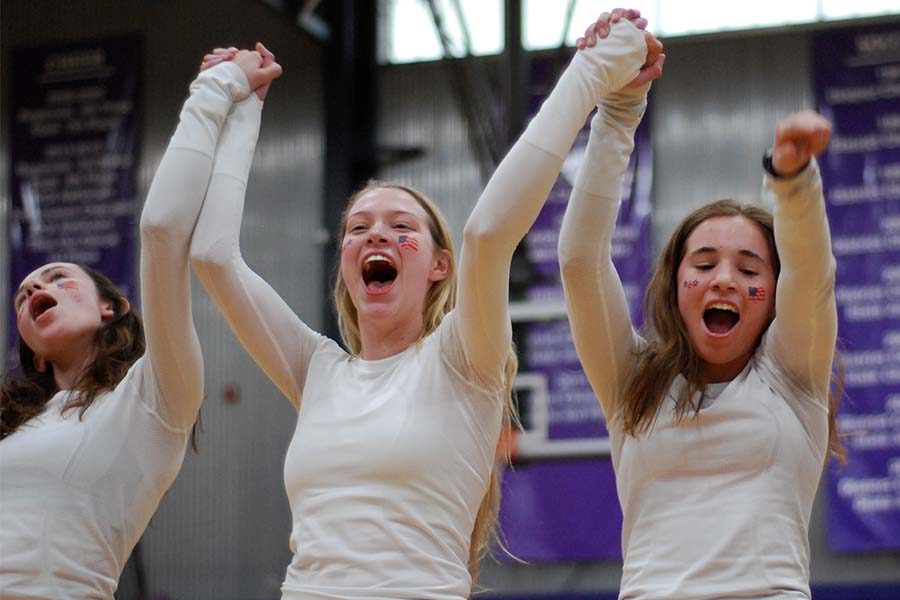 Seniors Claire Lewing, Sarah Tappan and Gabby Grimaldi celebrate a high score by the judges for the senior Stuco dance at Sion Olympics March 7.