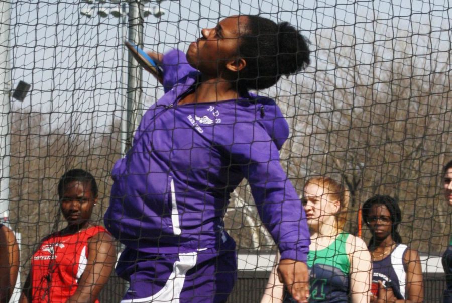 Senior Kendall Rogers throws shot put at the Bishop Miege Invitational April 5. (Photo by Allie Dierks)