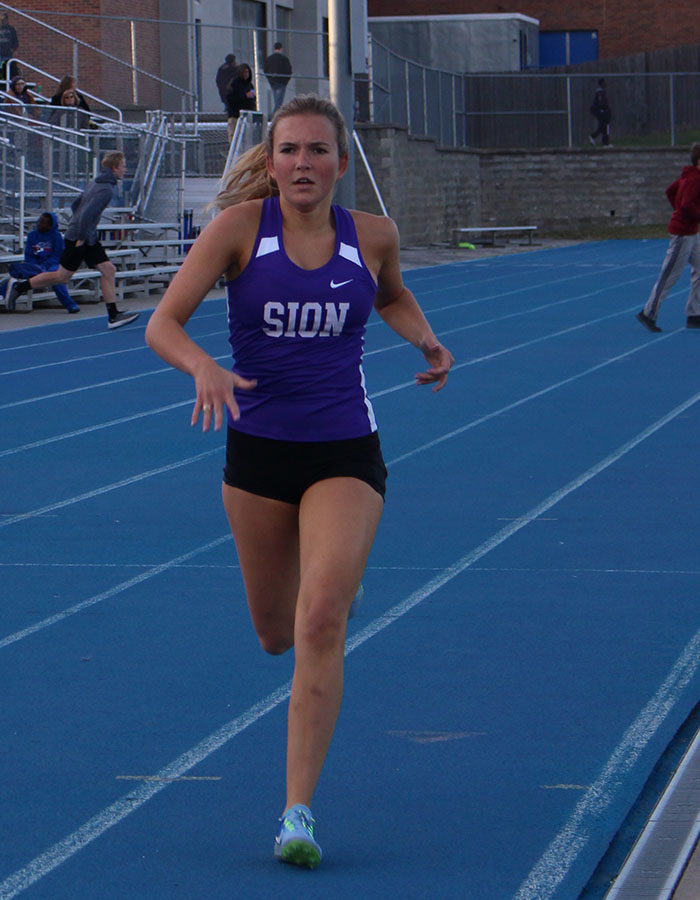 Senior Mia McLey finishes the final lap of the eight hundred meter run at the Brutus Hamiliton Invitational at Harrisonville High School April 12.