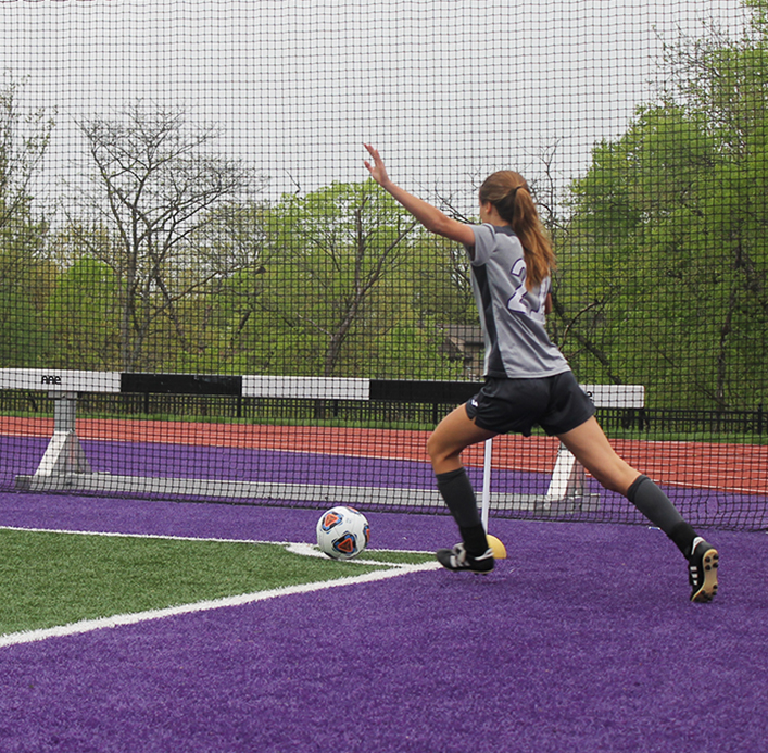 Junior Rose Orrick runs up to kick the ball back into play during their game against Belton April 24. The team won in penalty kicks after the score remained at 1-1 throughout overtime. 