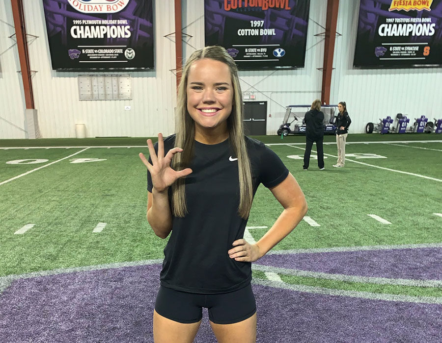 Standing in the middle of the Power Cat, senior Liz Oltjen beams with excitment after making the Kansas State University cheer team April 28.