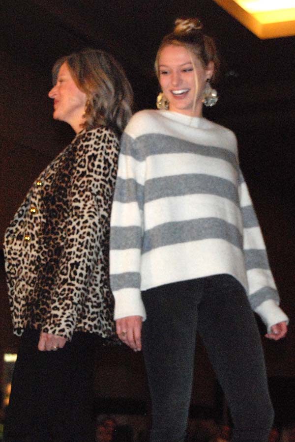 Strutting downt the runway with her mom Laura Tappan, senior Sarah Tappen poses at the end of the catwalk at the Mothr Daughter brunch at the Overland Park Sheraton Sept. 16.