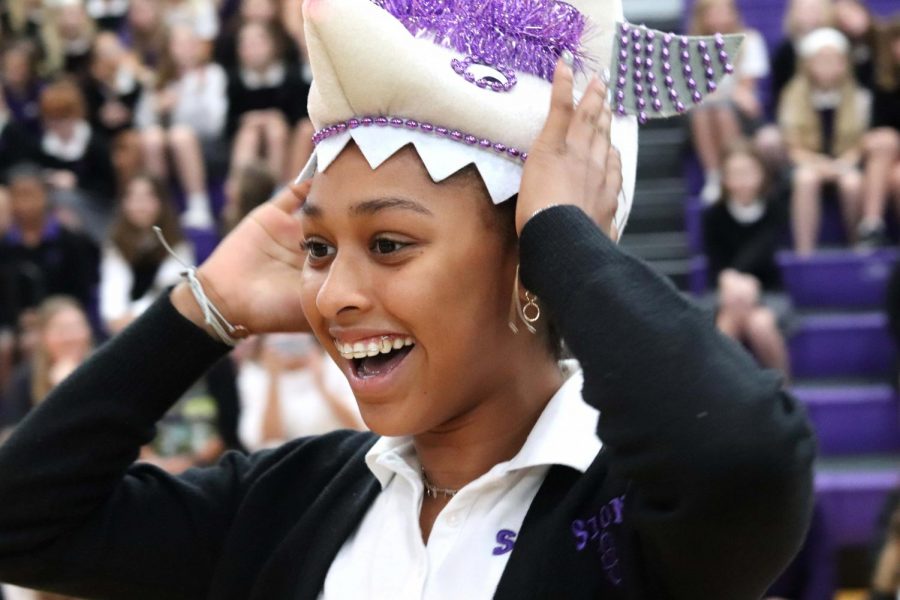 Making her way over to the freshmen who’ve received their beanies, freshman Ellington Presley adjusts her shark-shaped creation so she can see.