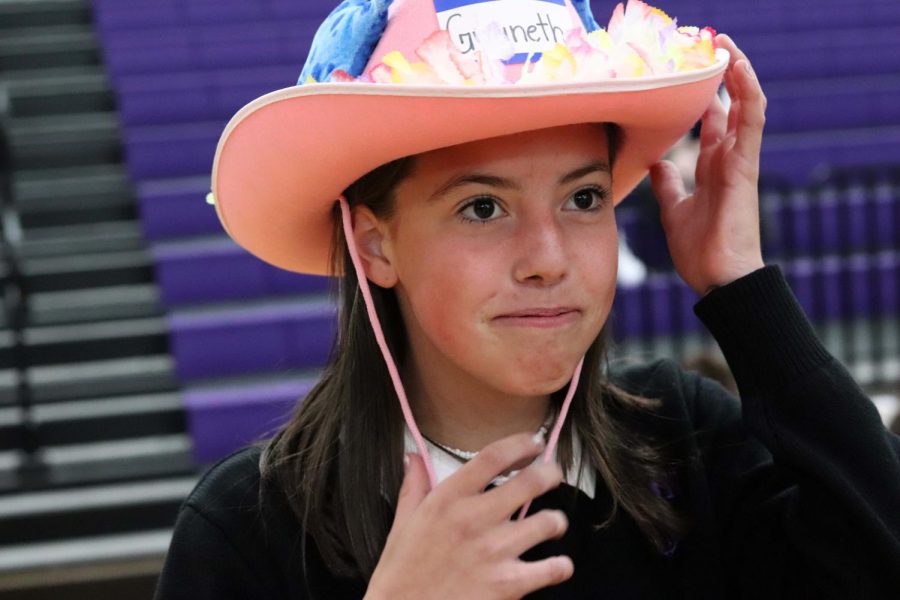 Freshman Gwyn Johnson stands to the side after she gets her beanie from seniors Aug. 22. The beanie presentation is an annual event held to introduce the freshmen to the rest of the school. 