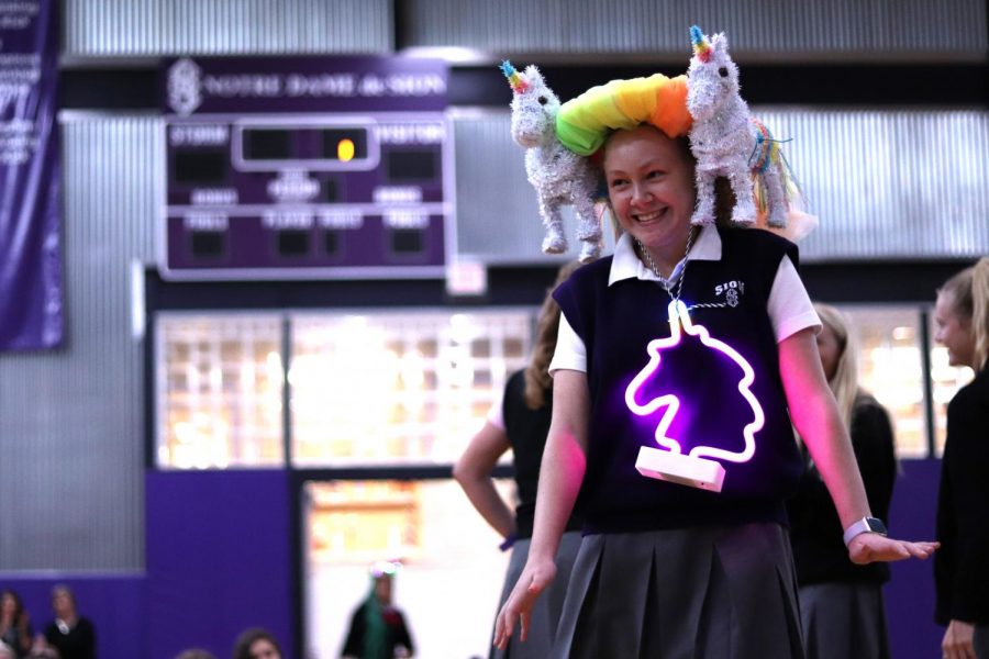 Freshman Makayla Herbert, member of Maison Long, struts with a unicorn themed beanie Aug. 22.