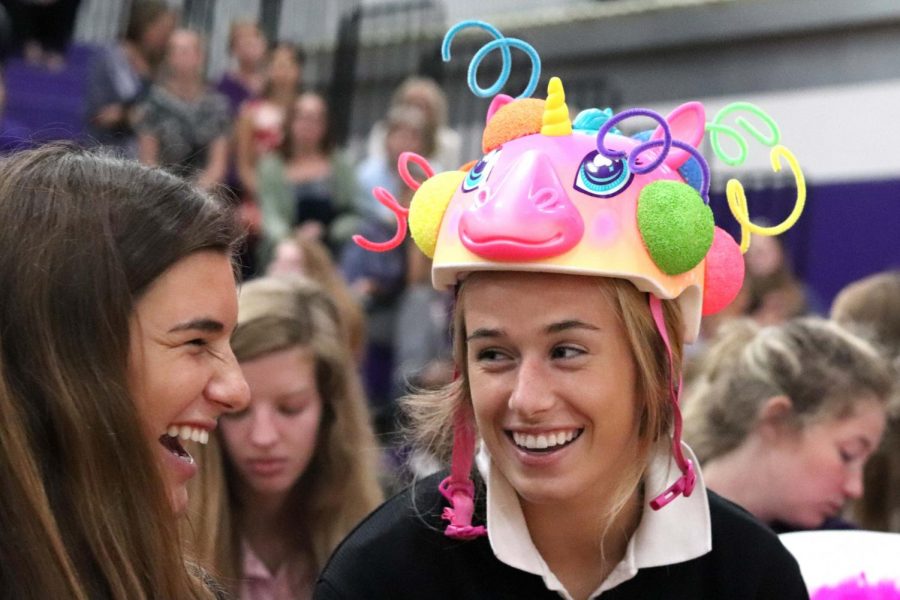 Before the beanie ceremony, seniors Reilly Jackoboice and Felicia Knox prepare to give the freshmen in their maisons their beanies Aug. 22. 