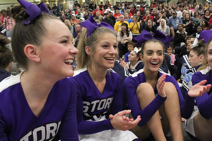 Senior Captains Brooke McKee, Caroline Knopke and Meg Wilkerson cheer on other teams' results at Regionals Oct. 20. 