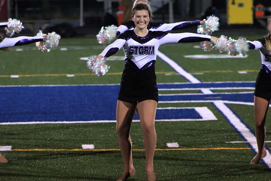 Senior Ava Grace Vermillion preps for a turn during the dance team performance at Rockhurst High School Oct. 18. This was Vermillion’s last performance at Rockhurst.