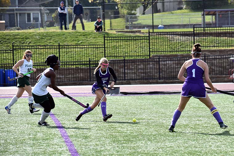 Sophomore forward Marie Messerli passes the ball upfield during the varsity game at Sion Oct. 19. Varsity won 1-0.