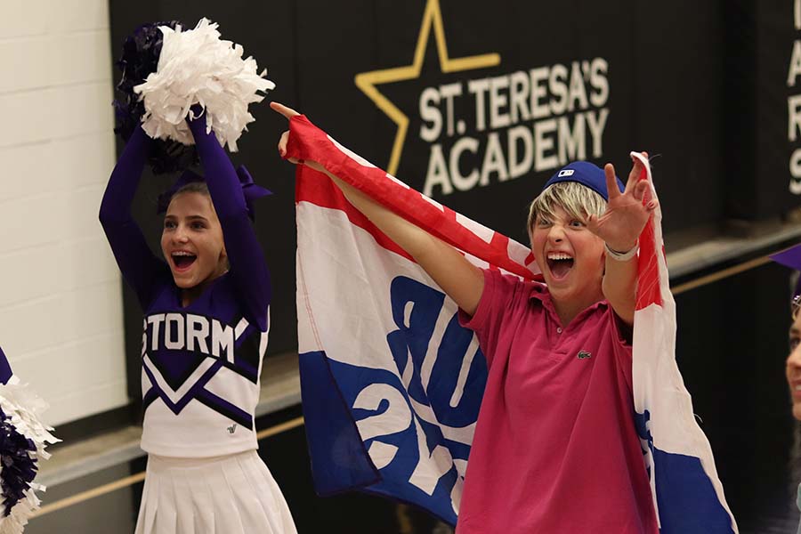 Senior Brie Bowes and freshman Emily Dierks hype up the crowd before the varsity basketball game at St. Teresa's Academy Dec. 6. The student theme was Boys. Storm basketball will play  the Stars Thursday, Feb. 27 in the gym. 