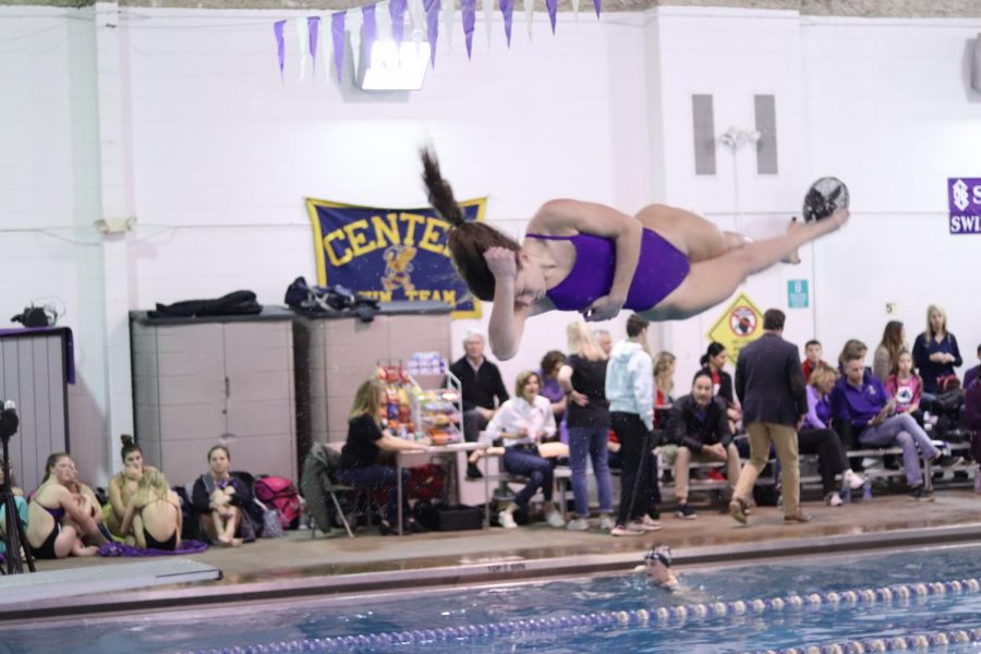 Senior dive captain Caroline Knopke warms up her front twister for the St. Teresa's Academy Dual meet on Jan. 28.