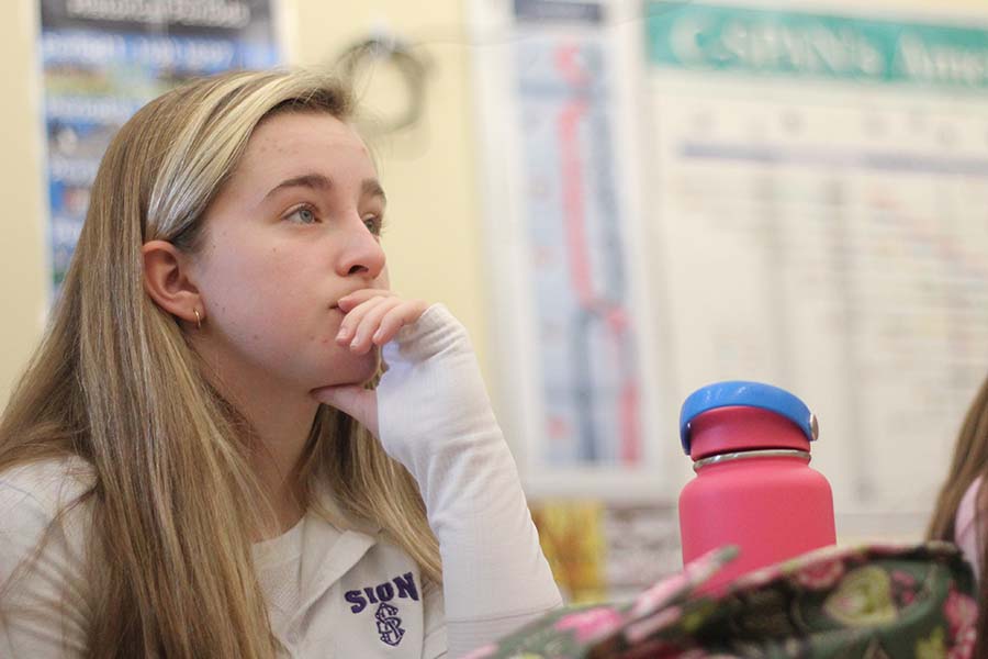 Sophomore Liesl Riffe listens to Lauren Cimpl, Class of '04, speak about her job at an insurance agency during Career Day on Jan. 16.